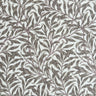 Beige Ramas vaxduk med William Morris-inspirerat bladmönster på ljus botten.