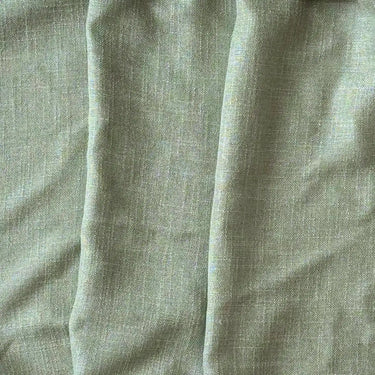 Pistagegrönt Alan tyg med linne-look, lätt struktur och följsamt fall i mjuk polyester- och viskosblandning