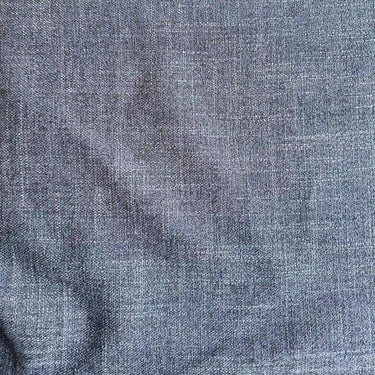 Dallas strukturvävt möbeltyg i färgen Denim med melerad blå vävstruktur.