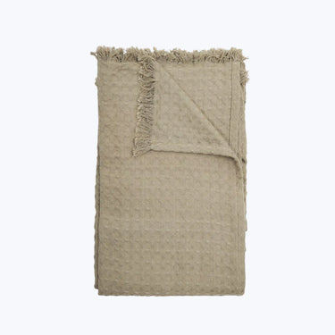 Mellby beige bomullspläd med strukturerat mönster och fransade kanter